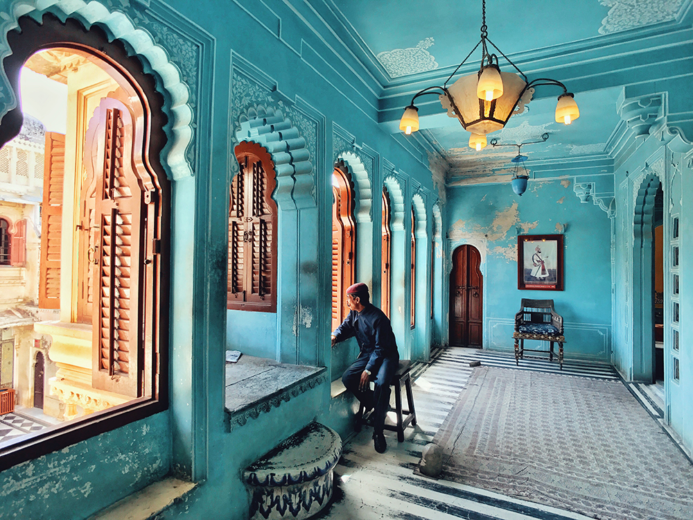 Kuanglong Zhang Shenzhen, China 3rd Place, Photographer of the Year iPhone 7 The City Palace “Udaipur is one of the most romantic cities in India. in the City palace, I snapped a moment of one of the staff gazing out of the window as if he saw the slowly historic course of the palace’s construction, which was as quite attractive moment.”