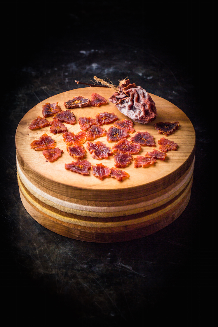 Air-dried Hachiya Persimmons (Hoshigaki) served on a big cake plate from culinary artist Andrea Blum.